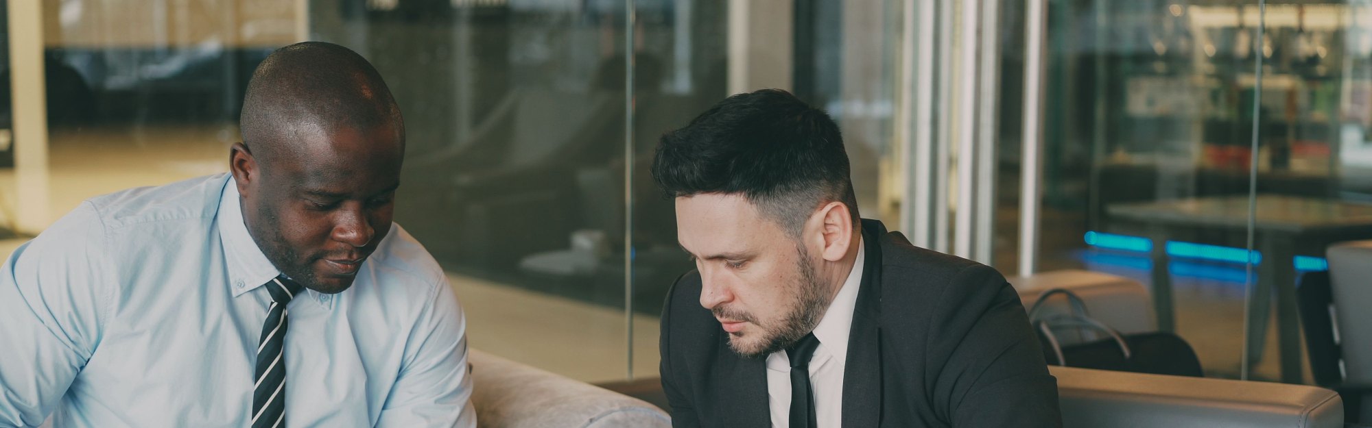 Two people reviewing charts in a meeting